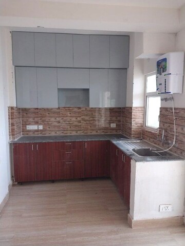 Kitchen in 2 BHK Apartment at Amrapali Terrace Homes, Tech Zone 4 Greater Noida – for Rent