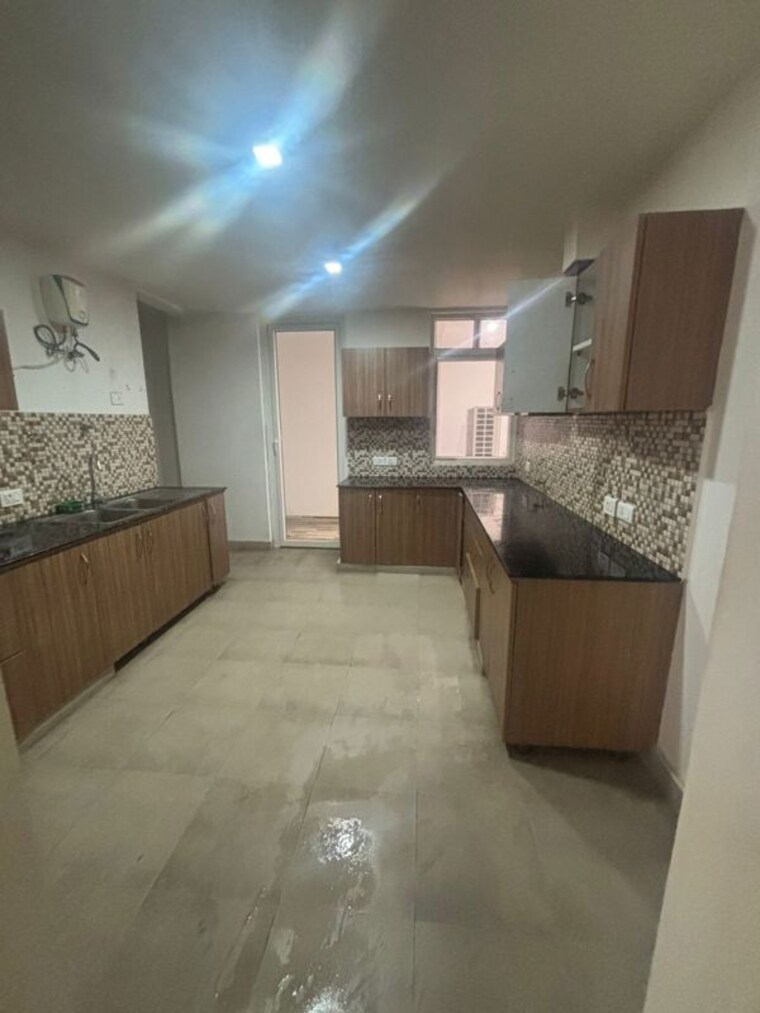 Kitchen, urban-axis-urban-woods 2 Bedroom 749 Sq.Ft. Apartment In Sushant Golf City Lucknow 10080456