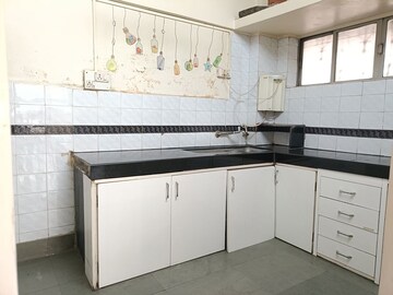 Kitchen in 2 BHK Apartment at Samruddhi Apartments, Camp – for Rent