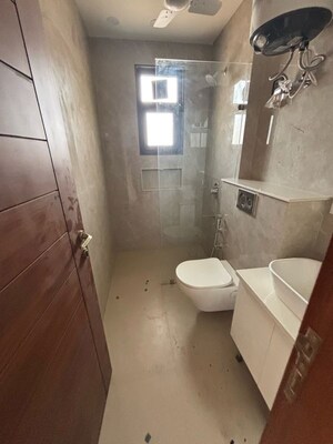Bathroom in 4 BHK Builder Floor at Ansal API Versalia, Sector 67a – for Rent