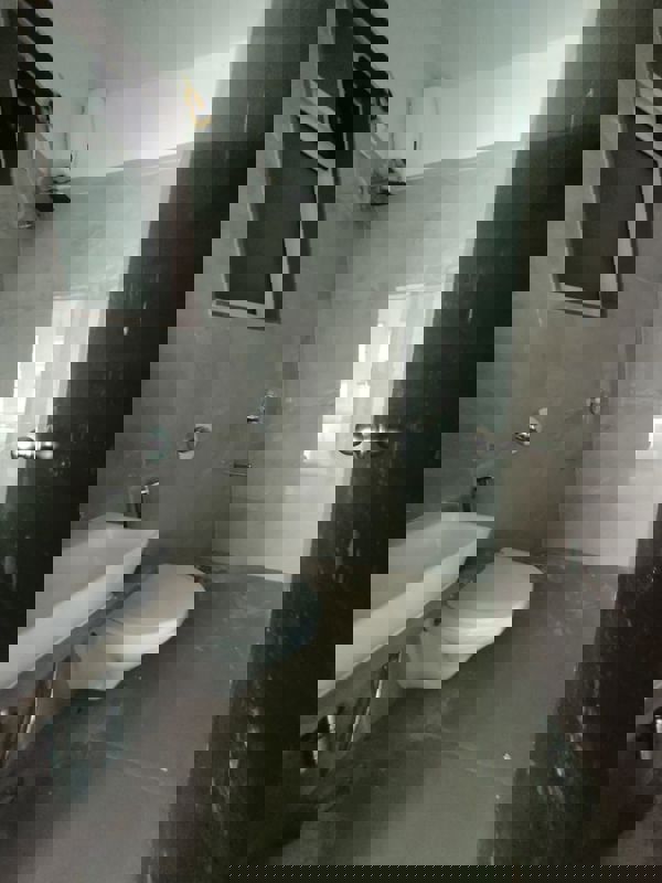 Bathroom in 2.5 BHK Apartment at Elite The Crown, Tilak Nagar – for Rent