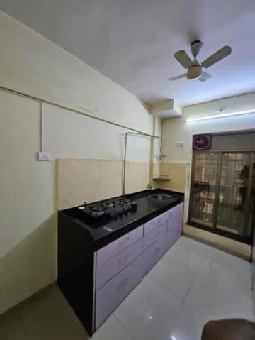 Kitchen in 2 BHK Apartment at Shree Krishna Heights Malad, Malad East – for Rent