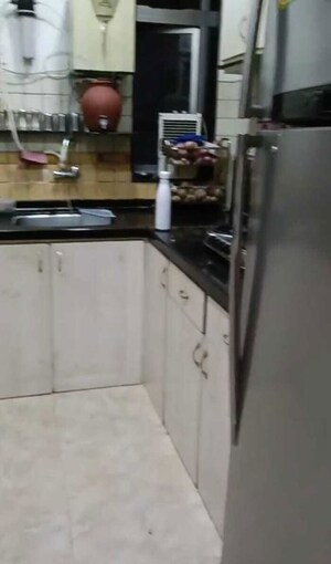Kitchen in 3 BHK Apartment at Giriraj Apartments, Altamount Road – for Rent