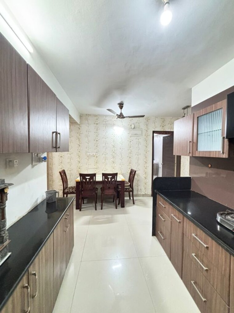 Kitchen, sukhwani-elmwood 2 Bedroom 810 Sq.Ft. Apartment In Pimple Saudagar Pune 10083889