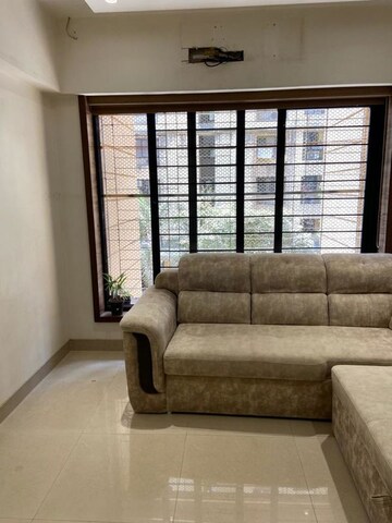 Living Room in 1 BHK Apartment at Shiv Aradhana CHS, Malad West – for Sale