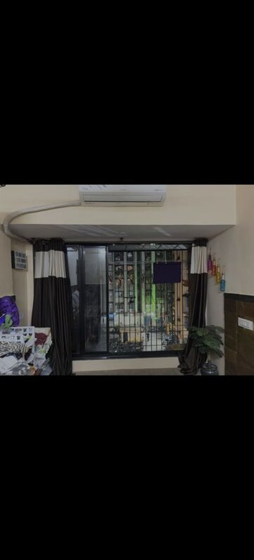 Living Room in 2 BHK Apartment at Romell Diva, Malad West – for Rent