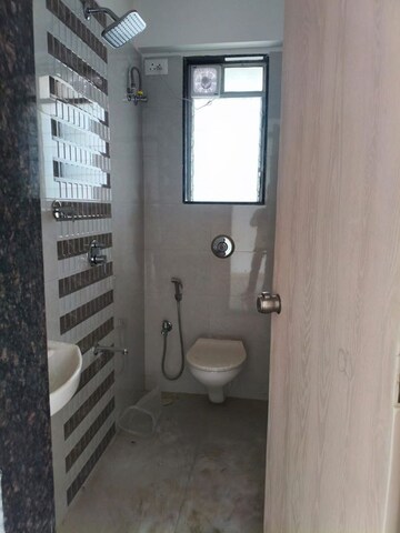 Bathroom in 1 BHK Apartment at Shraddha Vardaan, Bhandup West – for Rent