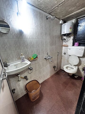 Bathroom in 2 BHK Apartment at Vasant Valley Complex, Malad East – for Rent