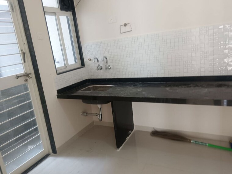 Kitchen, basil-mondale 2 Bedroom 750 Sq.Ft. Apartment In Mundhwa Pune 10085680