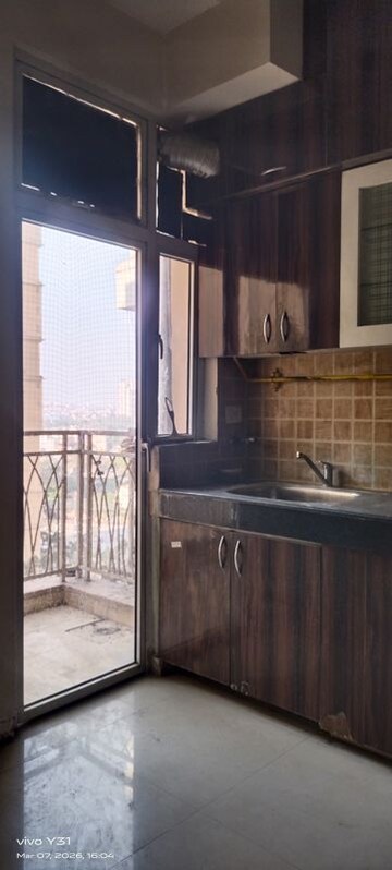 Kitchen in 2.5 BHK Apartment at Mahagun Mywoods, Sector 16c Greater Noida – for Sale