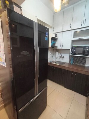 Kitchen in 2 BHK Apartment at Exotica Dreamville, Sector 16c Greater Noida – for Rent