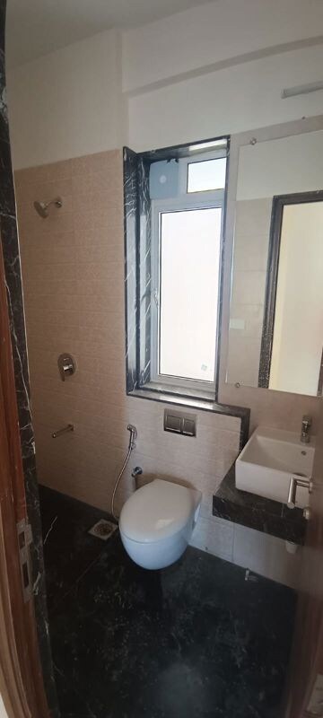 Bathroom in 1 BHK Apartment at Akshardham CHS, Malad West – for Rent