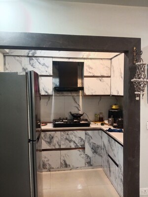 Kitchen in 2 BHK Apartment at Mahagun Mywoods III, Sector 16c Greater Noida – for Rent