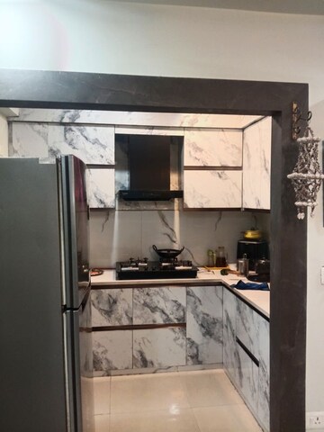 Kitchen in 2 BHK Apartment at Mahagun Mywoods III, Sector 16c Greater Noida – for Rent