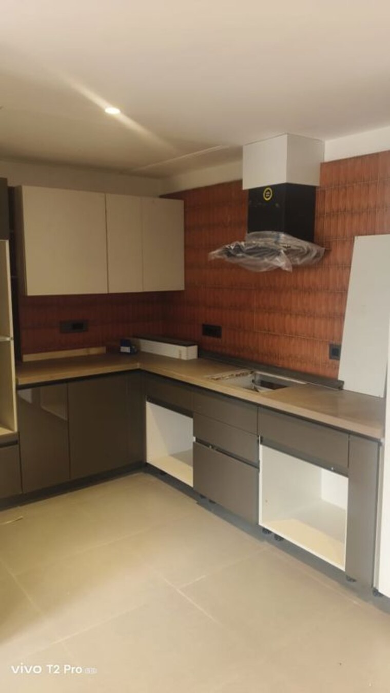 Kitchen, unitech-uniworld-resorts-the-residences 5 Bedroom 6880 Sq.Ft. Villa In Sector 33 Gurgaon 10086725