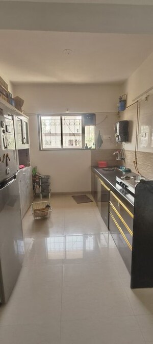 Kitchen in 2 BHK Apartment at Shradha Heritage, Pimple Saudagar – for Rent