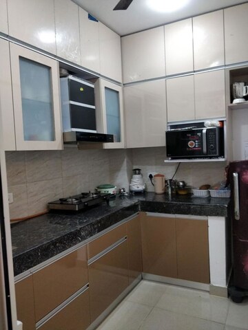 Kitchen in 2.5 BHK Apartment at Ajnara Le Garden, Sector 16b Greater Noida – for Sale