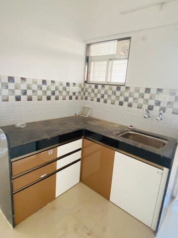 Kitchen in 2 BHK Apartment at Raj Heramba Venkatesh Imperia, Tathawade – for Rent