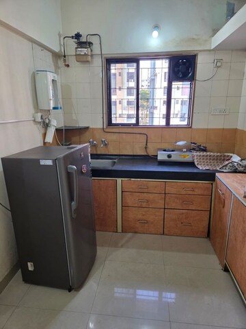 Kitchen in 1 BHK Apartment at Magarpatta City Heliconia, Hadapsar – for Rent