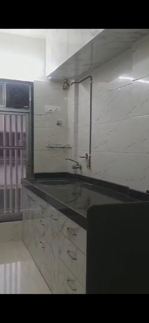 Kitchen in 2 BHK Apartment at Umang Shastri Nagar West View CHS, Goregaon West – for Rent