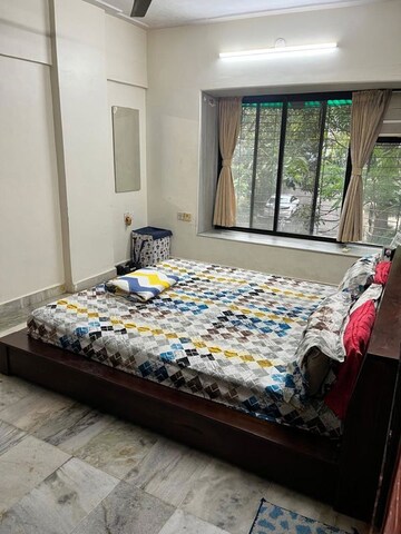Bedroom in 2 BHK Apartment at Madhurima CHS, Andheri West – for Rent