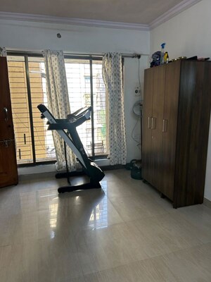 Living Room in 1 BHK Apartment at Empire Tower, Andheri West – for Rent