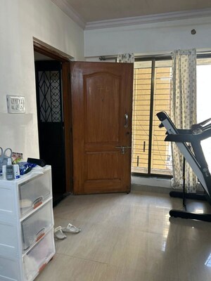 Living Room in 1 BHK Apartment at Empire Tower, Andheri West – for Rent