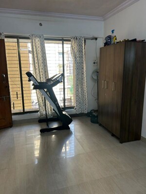 Living Room in 1 BHK Apartment at Empire Tower, Andheri West – for Rent