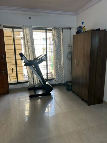 Living Room in 1 BHK Apartment at Empire Tower, Andheri West – for Rent
