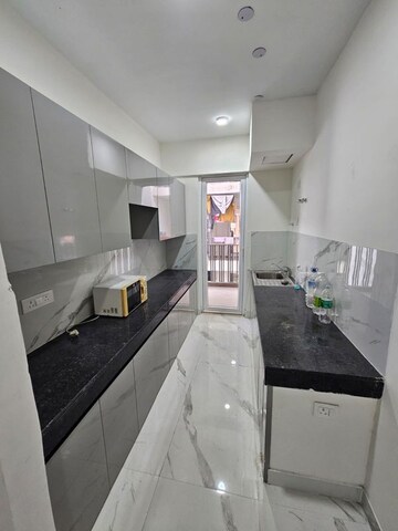 Kitchen in 3.5 BHK Builder Floor at Smart World Gems, Sector 89 – for Rent