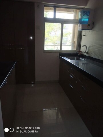 Kitchen in 1 BHK Apartment at Squarefeet Ace Square, Thane West – for Rent