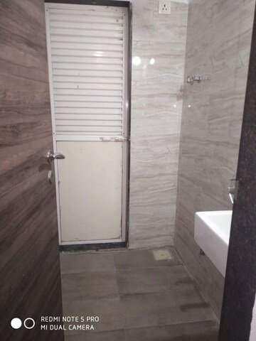 Bathroom in 1 BHK Apartment at Squarefeet Ace Square, Thane West – for Rent