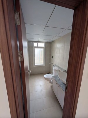 Bathroom in 1 BHK Apartment at Bhartiya City Nikoo Homes 4, Thanisandra Main Road – for Sale