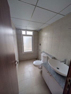 Bathroom in 1 BHK Apartment at Bhartiya City Nikoo Homes 4, Thanisandra Main Road – for Sale