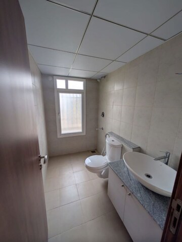 Bathroom in 1 BHK Apartment at Bhartiya City Nikoo Homes 4, Thanisandra Main Road – for Sale