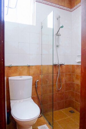 Bathroom in 3 BHK Apartment at Evershine Cosmic, Andheri West – for Rent