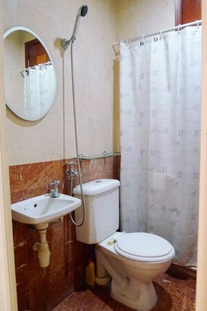Bathroom in 3 BHK Apartment at Evershine Cosmic, Andheri West – for Rent