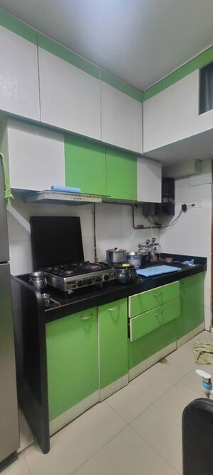 Kitchen in 3 BHK Apartment at Sandstone CHS Ltd, Mira Road – for Rent