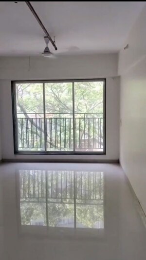 Room in 2 BHK Apartment at Bini Winspace Amelio, Andheri West – for Sale