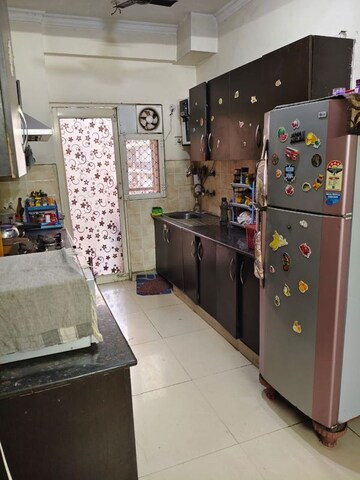 Kitchen in 2.5 BHK Apartment at Aims Golf City, Sector 75 – for Rent