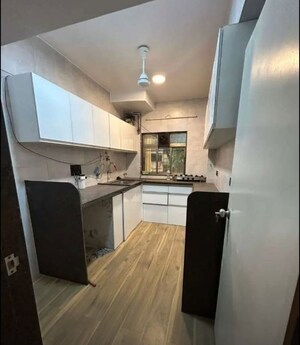 Kitchen in 2 BHK Apartment at Bhag CHS, Shivaji Park – for Rent