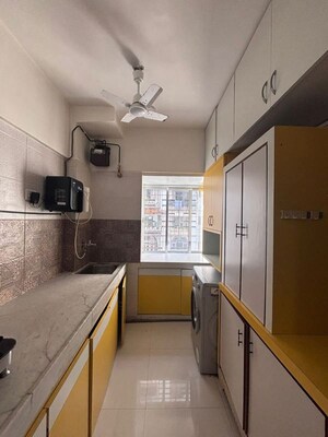 Kitchen in 2 BHK Apartment at Thakur Badrinath Tower, Andheri West – for Rent