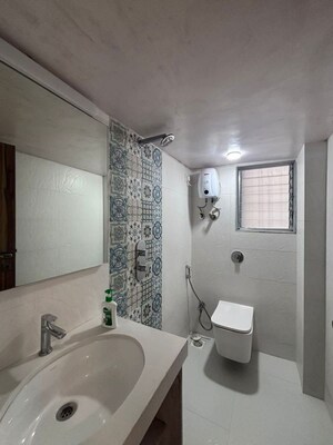 Bathroom in 2 BHK Apartment at Thakur Badrinath Tower, Andheri West – for Rent