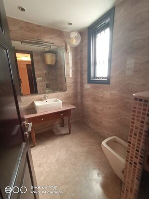 Bathroom in 3 BHK Builder Floor at Pamposh Enclave – for Rent