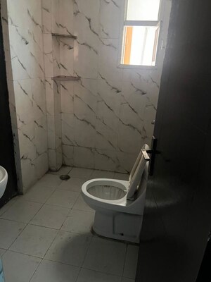 Bathroom in 2 BHK Apartment at Shyam Bankey Bihari Sharnam, Raj Nagar Extension – for Sale