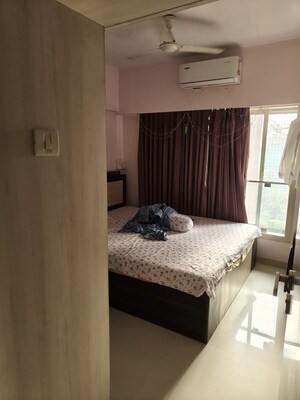 Bedroom in 2 BHK Apartment at Romell Umiya Grandeur, Goregaon East – for Rent