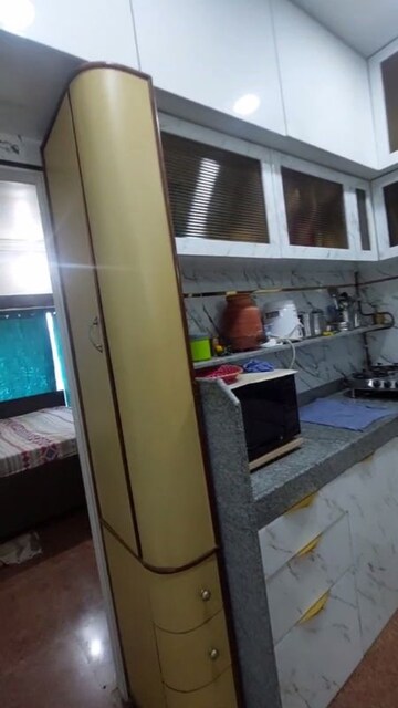 Kitchen in 1.5 BHK Apartment at Golden Palace CHS, Kandivali East – for Sale