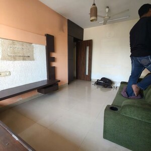Living Room in 1 BHK Apartment at K Raheja Palm Spring, Malad West – for Rent