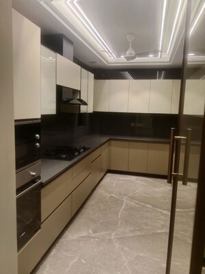 Kitchen in 4 BHK Apartment at Tata Raheja Raisina Residency, Sector 59 – for Sale
