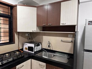 Kitchen in 2 BHK Apartment at Hiranandani Estate Queens, Ghodbunder Road – for Rent